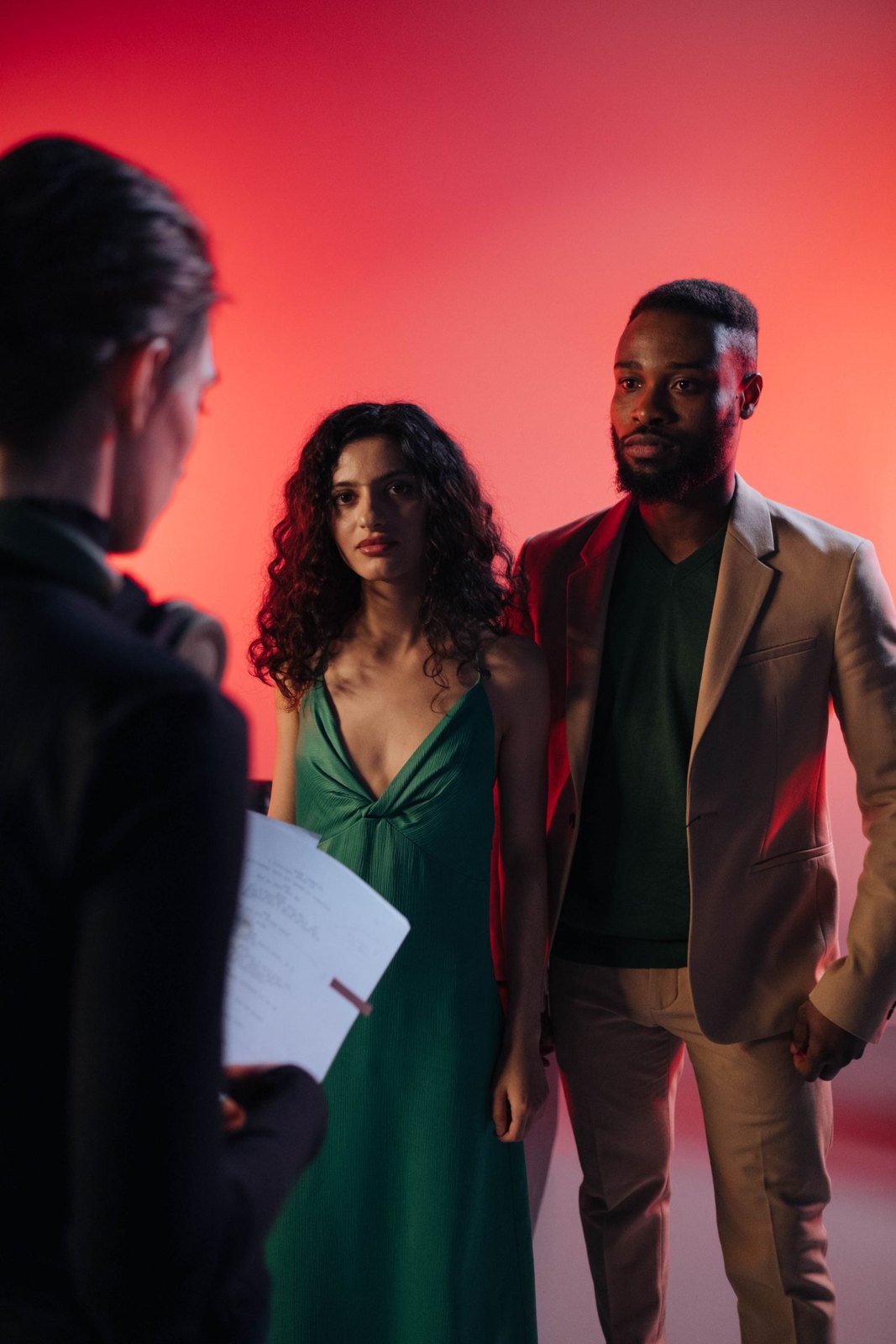 Performers discussing a scene before recording.