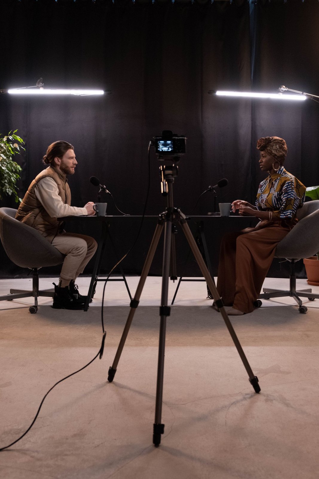 A recorded conversation with microphones and video equipment.